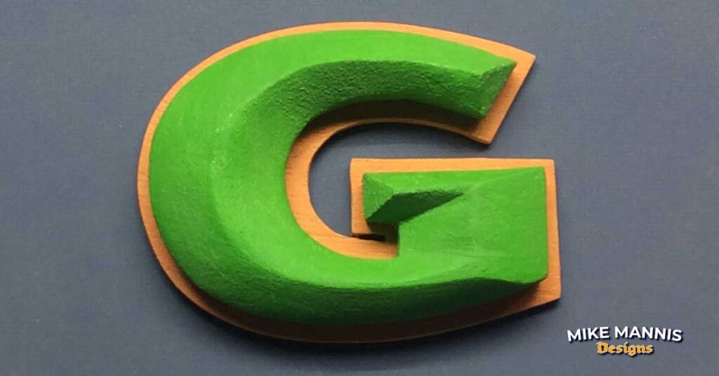 Carved foam Letter G with wood outline.